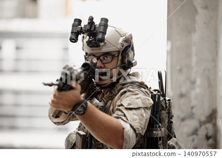 Special forces soldier aiming rifle, military tactical operation portrait Special forces soldier aiming rifle, military tactical operation portrait 140970557