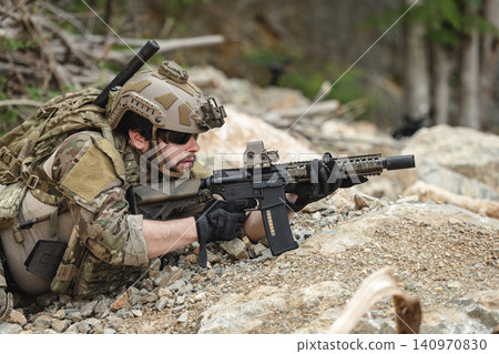 US Special forces soldiers engaged in combat operation, tactical military team in action US Special forces soldiers engaged in combat operation, tactical military team in action 140970830