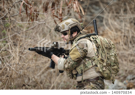 Military rangers, US Marine engaged in jungle combat operation deep in tropical forest Military rangers, US Marine engaged in jungle combat operation deep in tropical forest 140970834