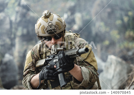 US Marine, Military Special forces soldier under heavy enemy fire intense battlefield engagement 140970845