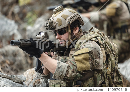 US Marine, Military Special forces soldier under heavy enemy fire intense battlefield engagement 140970846