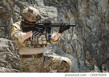 US Special forces soldiers engaged in combat operation, tactical military team in action US Special forces soldiers engaged in combat operation, tactical military team in action 140970849