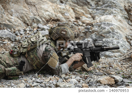 US Special forces soldiers engaged in combat operation, tactical military team in action US Special forces soldiers engaged in combat operation, tactical military team in action 140970953