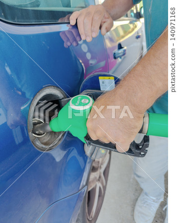 Refueling Car at Gas Station Refueling Car at Gas Station 140971168