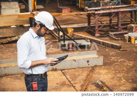 Asian Indian construction Engineer male, Builder lead construction site working control operate site. Asian Indian construction Engineer male, Builder lead construction site working control operate site. 140972099