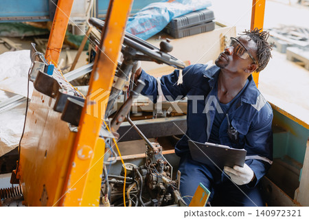 Black African young worker man working fix service repair industry vehicle electricity wiring Black African young worker man working fix service repair industry vehicle electricity wiring 140972321