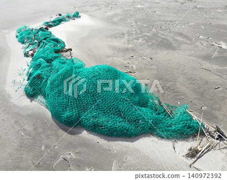 Debris washed ashore: fishing nets Debris washed ashore: fishing nets 140972392