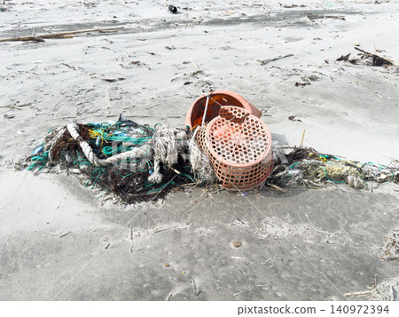 Garbage washed ashore, fishing ropes, baskets, etc. Garbage washed ashore, fishing ropes, baskets, etc. 140972394