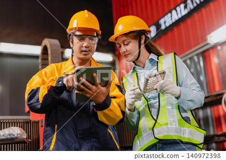 Professional worker man working in metal part workshop, Quality control staff looking product part. 140972398