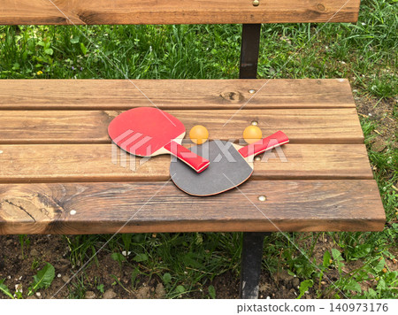 Top View of Ping Pong Rackets on Wooden Slats Top View of Ping Pong Rackets on Wooden Slats 140973176