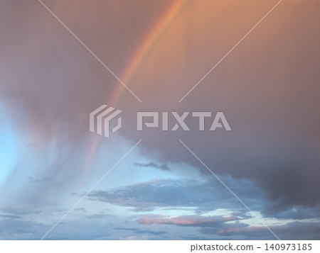 Double rainbow over dramatic storm clouds at sunset 140973185