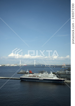 A cruise ship docked at the pier with the Bay Bridge in the background. A cruise ship docked at the pier with the Bay Bridge in the background. 140973390