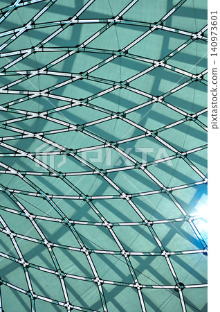The low angle view of the building ceiling. Interior of modern architecture, modern city building. Interior design. Details of modern architecture. Building abstract. Building background. 140973601