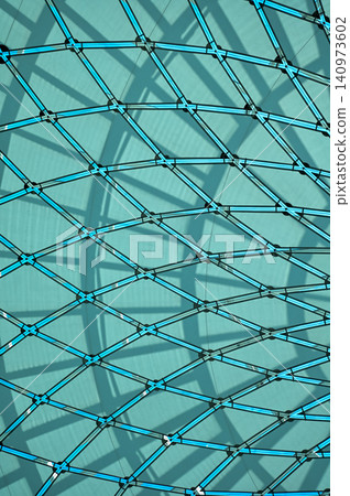 The low angle view of the building ceiling. Interior of modern architecture, modern city building. Interior design. Details of modern architecture. Building abstract. Building background. The low angle view of the building ceiling. Interior of modern architecture, modern city building. Interior design. Details of modern architecture. Building abstract. Building background. 140973602