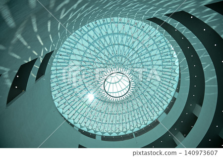 The low angle view of the building ceiling. Interior of modern architecture, modern city building. Interior design. Details of modern architecture. Building abstract. Building background. The low angle view of the building ceiling. Interior of modern architecture, modern city building. Interior design. Details of modern architecture. Building abstract. Building background. 140973607