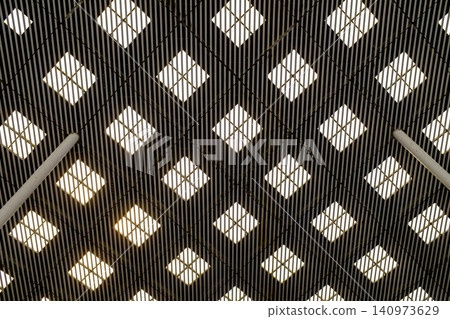 The low angle view of the building ceiling. Interior of modern architecture, modern city building. Interior design. Details of modern architecture. Building abstract. Building background. The low angle view of the building ceiling. Interior of modern architecture, modern city building. Interior design. Details of modern architecture. Building abstract. Building background. 140973629