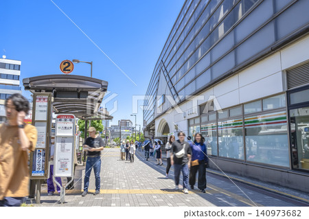 Urban landscape of Setagaya Ward, Tokyo: Station building and bus stop in front of Kyodo Station 140973682