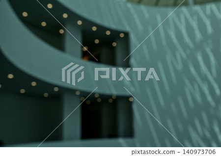 The bokeh effect of the building. Interior of modern architecture, modern city building. Interior design. Details of modern architecture. Building abstract. Building background. The bokeh effect of the building. Interior of modern architecture, modern city building. Interior design. Details of modern architecture. Building abstract. Building background. 140973706