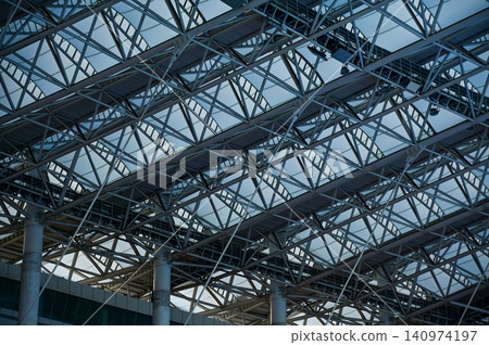 Close-up of the stadium ceiling. Modern architecture, modern city building. Exterior design. Details of modern architecture. Building abstract. Building background. Close-up of the stadium ceiling. Modern architecture, modern city building. Exterior design. Details of modern architecture. Building abstract. Building background. 140974197