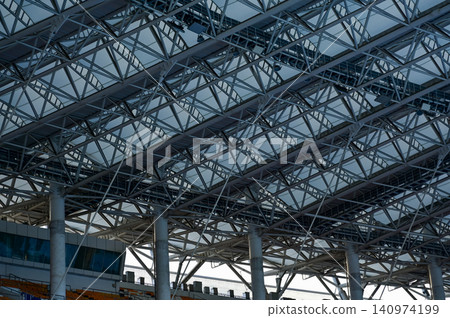 Close-up of the stadium ceiling. Modern architecture, modern city building. Exterior design. Details of modern architecture. Building abstract. Building background. 140974199