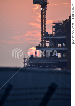 Crane truck working in construction site with sky background. Crane against sky. Crane, Construction background, construction equipment crane background. Crane truck working in construction site with sky background. Crane against sky. Crane, Construction background, construction equipment crane background. 140974674