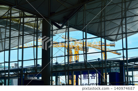 Crane truck working in construction site with sky background. Crane against sky. Crane, Construction background, construction equipment crane background. Crane truck working in construction site with sky background. Crane against sky. Crane, Construction background, construction equipment crane background. 140974687