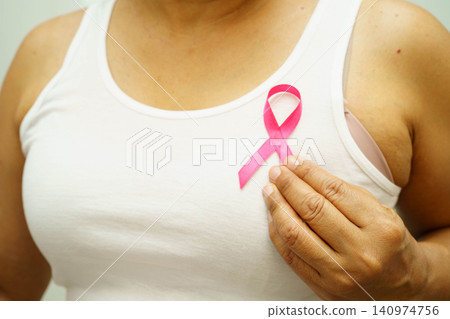 Asian woman with pink ribbon for October world breast cancer day. 140974756
