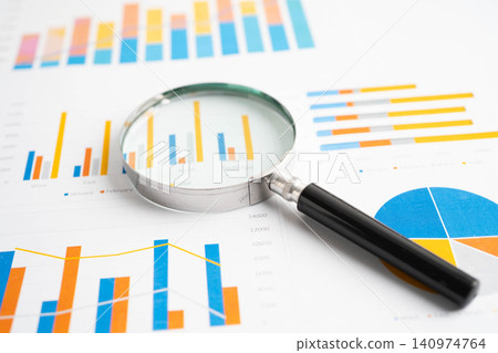 Magnifying glass on charts graphs paper. Financial development, Banking Account, Statistics, Investment Analytic research data economy. Magnifying glass on charts graphs paper. Financial development, Banking Account, Statistics, Investment Analytic research data economy. 140974764