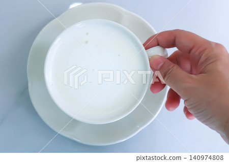 hot milk or a cup of milk 140974808