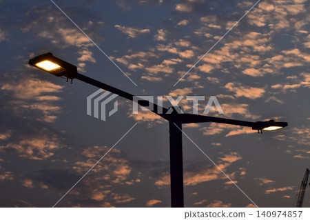 Close-up of the street light. Lighting in outdoors. Light bulb. Lighting in the city. Lamppost concept. Cityscape. Lighting equipment. Close-up of the street light. Lighting in outdoors. Light bulb. Lighting in the city. Lamppost concept. Cityscape. Lighting equipment. 140974857