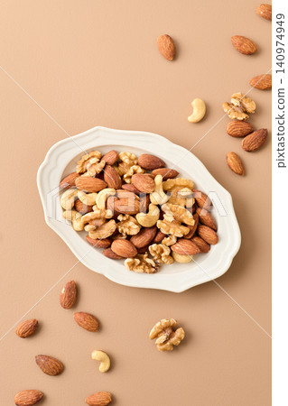 mixed nuts on a plate mixed nuts on a plate 140974949