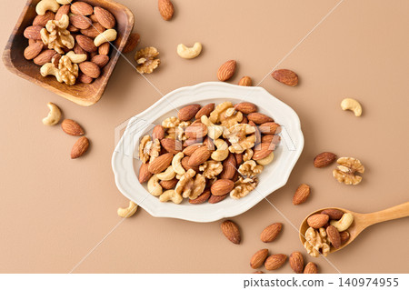 mixed nuts on a plate mixed nuts on a plate 140974955