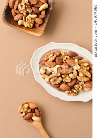mixed nuts on a plate mixed nuts on a plate 140974960
