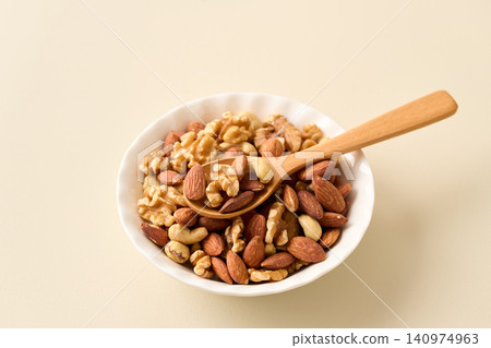 mixed nuts on a plate mixed nuts on a plate 140974963