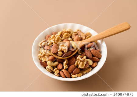 mixed nuts on a plate mixed nuts on a plate 140974975