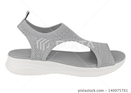 Grey knit fabric women's sport sandal with white sole isolated on white background Grey knit fabric women's sport sandal with white sole isolated on white background 140975781