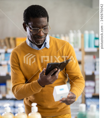 Adult man scanning qr code of pills 140976042