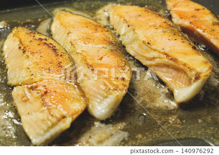 Salmon fillets pan-fried in butter Salmon fillets pan-fried in butter 140976292
