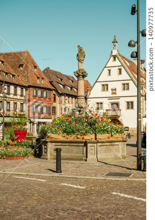 Timbered Facades and Gable Surrounding Central Fountain Timbered Facades and Gable Surrounding Central Fountain 140977735