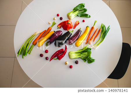 Fresh colorful vegetables arranged on table with eggplant Fresh colorful vegetables arranged on table with eggplant 140978141