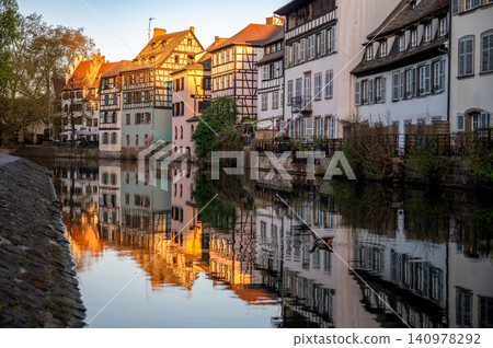 Romantic Houses Reflected in Calm Canal Golden Facades Romantic Houses Reflected in Calm Canal Golden Facades 140978292
