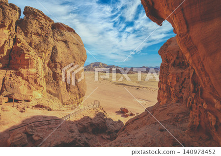 Timna valley. Sandstone cliffs in Timna park featuring King Solomon's Pillars Timna valley. Sandstone cliffs in Timna park featuring King Solomon's Pillars 140978452