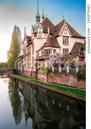Ornate Chateau Strasbourg Mirrored in Still Canal Water 140978465