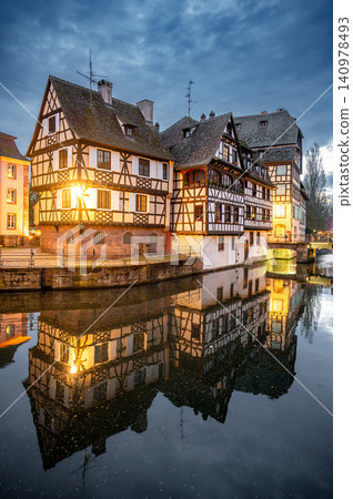 Evening Canal Warm Lights Reflecting on Calm Surface Evening Canal Warm Lights Reflecting on Calm Surface 140978493