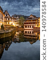 Stormy Dusk Sky Over Medieval Half-Timbered Roofs Canal 140978584