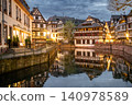 Tranquil Evening Promenade Timbered Buildings and Canal 140978589