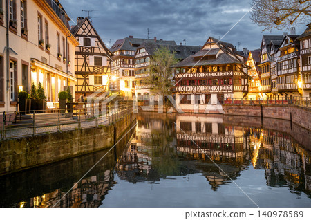 Tranquil Evening Promenade Timbered Buildings and Canal 140978589