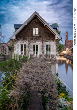 Historic Stone Facade Framed by Trimmed Wisteria Canal Historic Stone Facade Framed by Trimmed Wisteria Canal 140978590