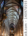 Soaring Vaulted Aisle With Banners and Stained Glass 140978593