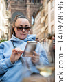 Tourist Woman at Cafe With Wine Glass Historic Street 140978596